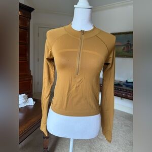 Lululemon Swiftly Tech 1/2 Zip 2.0 *Cool
Spiced Bronze / Tuscan Gold size 6